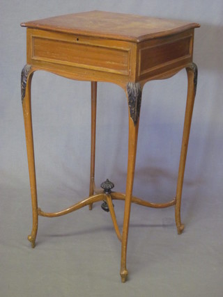 An Edwardian walnut square work table with hinged lid, raised  on cabriole supports united by an X framed stretcher 16"