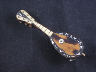 A tortoiseshell model of a mandolin 5"
