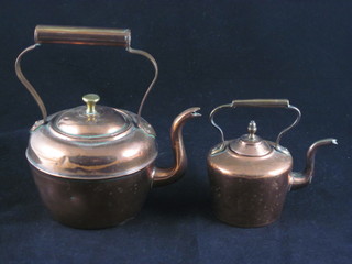 A circular miniature copper kettle 2" and 1 other 3"