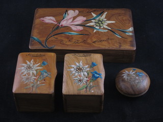 A rectangular painted olive wood trinket box with hinged lid and floral decoration 7 1/2", 2 ditto smaller trinket boxes 3" and a  circular jar and cover 2"