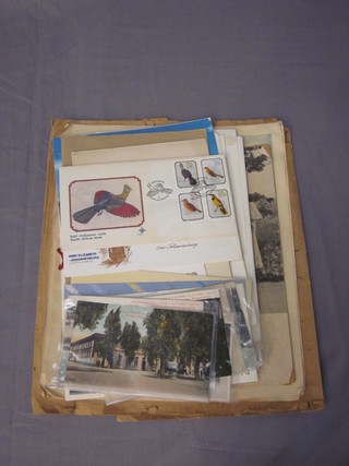 A small collection of postcards, presentation first day covers, various ephemera relating to South Africa