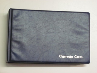 A blue album of cigarette cards
