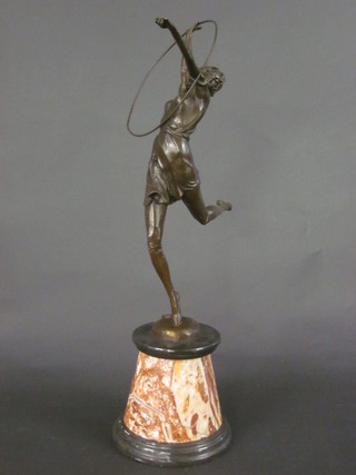 An Art Deco style bronze figure of a hoop girl, raised on a  marble base 24"