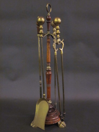 A brass fireside companion set