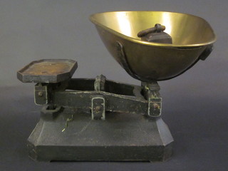 A pair of iron scales with brass pan and weights