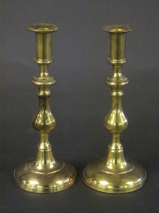 A pair of brass candlesticks 9"