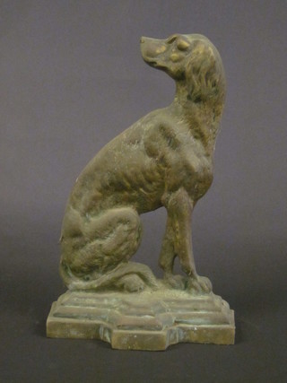 A brass door stop in the form of a seated dog 13"