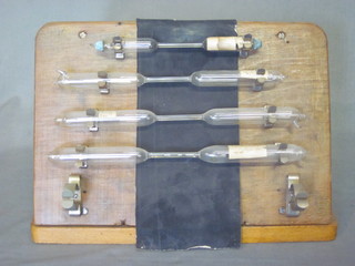 4 blown glass high voltage discharge tubes, 3 blown glass high voltage discharge tubes and 1 other