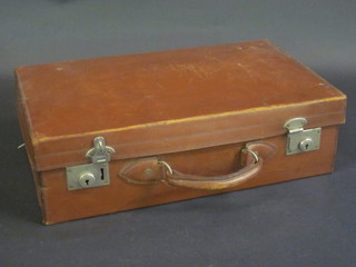 A brown leather vintage suitcase