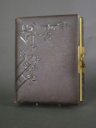 A Victorian leather bound family photograph album