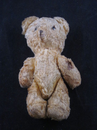A yellow teddybear with articulated limbs 6"