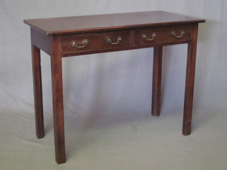 A 19th Century rectangular mahogany side table fitted 2 drawers  and raised on chamfered supports 36"