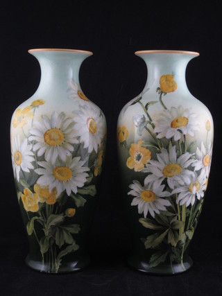 A pair of Doulton Lambeth floral patterned vases decorated daisies, the base impressed Doulton Lambeth 10", 1 cracked to  rim,