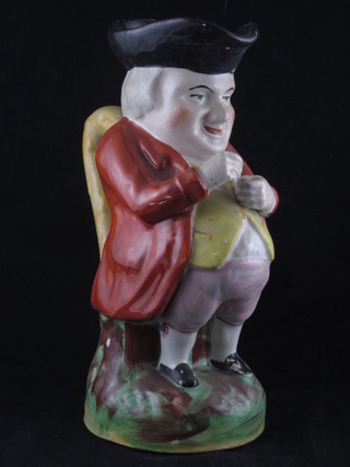 A 19th Century Staffordshire Toby jug in the form of Toby Philpots taking snuff 10"  ILLUSTRATED
