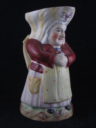 A 19th Century Staffordshire Toby jug in the form of a standing  lady 9 1/2"