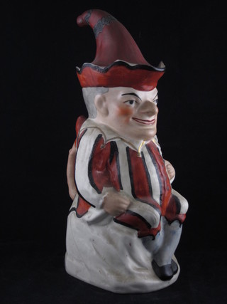 A 19th Century Staffordshire Toby jug in the form of a seated Mr Punch complete with hat 13"