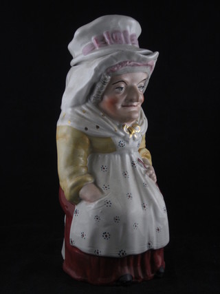 A 19th Century Staffordshire Toby jug in the form of Judy 11" complete with hat
