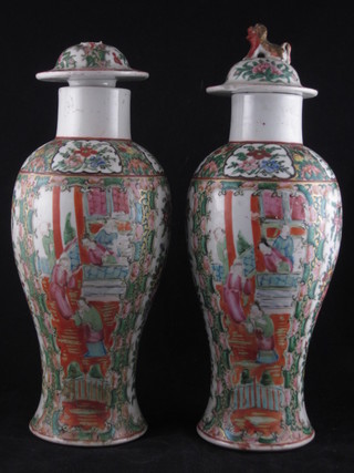 A pair of 19th Century Canton famille rose porcelain urns and cover 13", some damage,