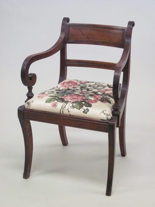 A Georgian mahogany open arm bar back desk chair with  upholstered drop in seat, raised on sabre supports