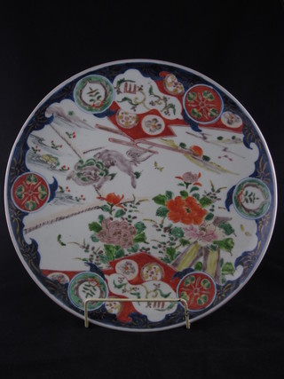 A circular Japanese Imari porcelain charger decorated a dragon  14 1/2"