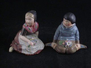 A pair of Royal Copenhagen porcelain figures of seated boy and  girl, base marked 12416, 4"