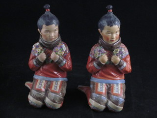 A pair of Royal Copenhagen porcelain figures of kneeling children - Gionland, base marked 12415 5"