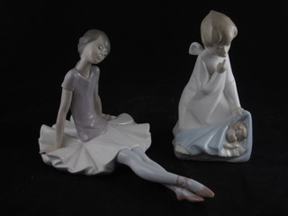 A Lladro figure of a seated ballet dancer 9", cracked, and 1  other of a kneeling Angel and baby 6", f and r,