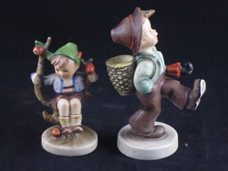 A Hummel figure of a walking boy with umbrella 5", heavily R, together 1 other of a seated boy 4"