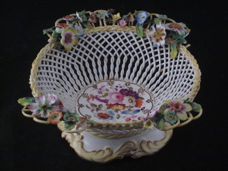 A German ribbonware porcelain bowl with floral decoration 7", some damage