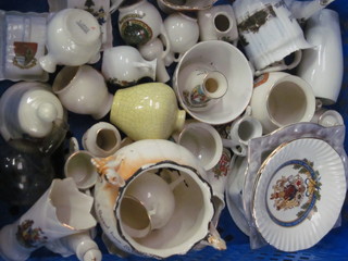 A pierced plastic crate containing a collection of various crested china