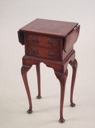 A Queen Anne style walnut bedside chest of 3 short drawers with drop flaps to the side, raised on cabriole supports 14"