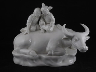 An Oriental style blanc de chine porcelain figure of a seated buffalo 7 1/2"