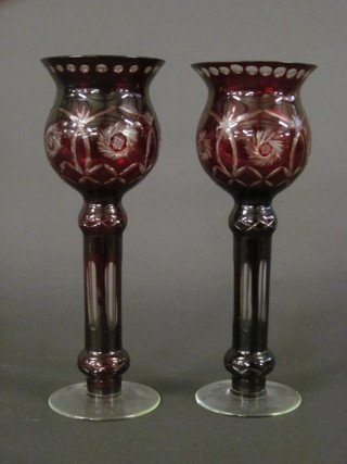 A pair of red overlay glass vases/candle holders of club form 12"