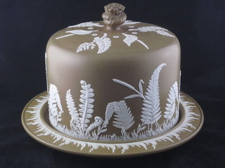 A Turnerware style brown glazed cheese dish and cover with  floral decoration 12"