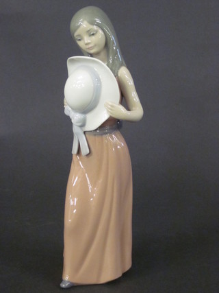A Lladro figure of a girl with bonnet, base marked Lladro Daisa 1978 9"