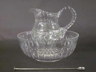 A large cut glass bowl 14" together with a cut glass jug and a  silver plated cocktail spoon