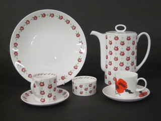 A 19 piece Susie Cooper Apple Gay coffee service comprising  coffee pot 7", 3 plates 10", sugar bowl, 5 saucers, 7 coffee cans,  large coffee cup and saucer together with a Susie Cooper Corn  Poppy pattern coffee can and saucer