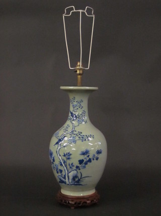 An Oriental blue and white porcelain vase of club form 18"