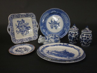 An Oriental style blue and white figure of a cat and a collection  of decorative blue and white china