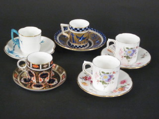 A Royal Crown Derby Imari pattern coffee can and saucer, a  Victorian Worcester coffee can and saucer with turquoise floral  decoration and Worcester mark to the base, a Coalport blue and  gilt patterned coffee can and saucer and 2 Royal Crown Derby  Posy pattern coffee cans and saucers