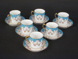 A 12 piece Royal Crown Derby coffee service comprising 6  coffee cans - 2 cracked, and 6 saucers, with blue ground and  floral decoration