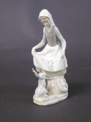 A Lladro figure of a dancing girl with rabbit