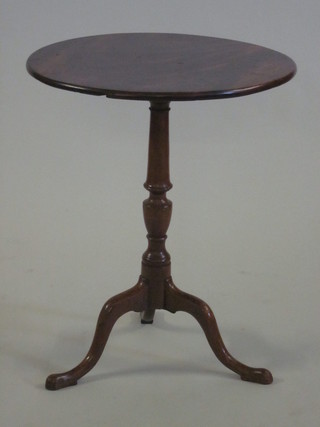 A 19th Century circular mahogany snap top wine table, raised on  a pillar and tripod base 21"