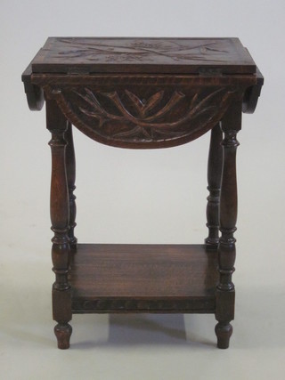 A Victorian carved oak dropflap occasional table, raised on  turned and block supports with undertier 20"