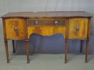 A Georgian style mahogany sideboard fitted 2 long drawers flanked by a pair of cupboards, raised on turned supports ending  in spade feet 60"