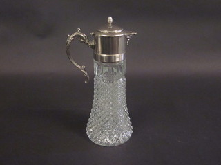 A moulded glass claret jug with silver plated mount 13"