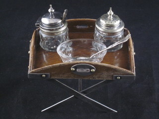A handsome Edwardian oak and silver plated condiment frame in  the form of a butler's tray, set cut glass salt, mustard and pepper  pot