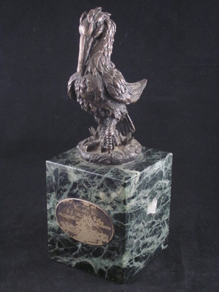 A Leslie Durbin silver sculpture of a pelican, raised on a marble  base ILLUSTRATED