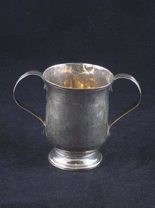 A George III silver twin handled cup, raised on a spreading foot,  London 1803, 3 1/2"