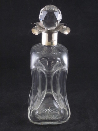 A waisted glass decanter with silver collar 9"